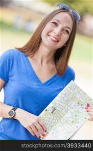 Photo of smiling brunette tourist with a map