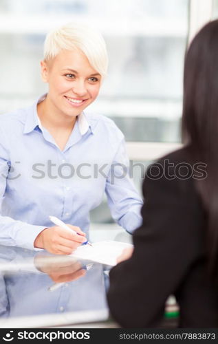 photo of smiling female manager doing a job interview