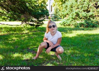 Photo of smiling girl in sunglass with sore knee