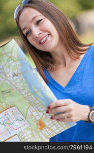 Photo of smiling woman with the map, tourism concept