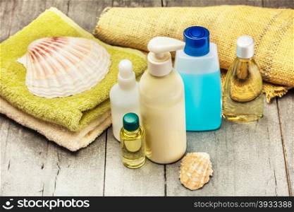 Photo of spa products over wooden table