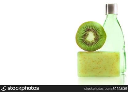 Photo of spa products with kiwi over white isolated background