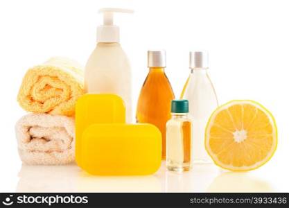 Photo of spa products with lemon over white isolated background