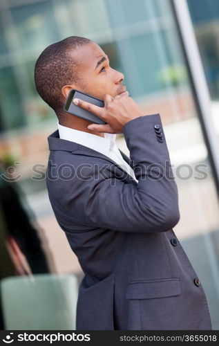 photo of successful african businessman phoning while smiling