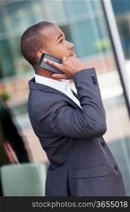 photo of successful african businessman phoning while smiling