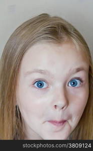 Photo of surprised cute girl with blond hair