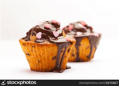 Photo of tasty cupcakes with chocolate over white isolated background