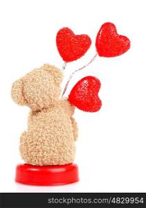 Photo of teddy bear with red heart-shaped balloon isolated on white background, back side of brown furry soft toy, romantic gift, sweet present for Valentine day holiday, love concept&#xA;