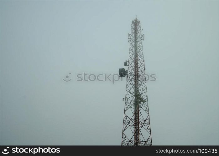 photo of telecommunication tower in misty sky