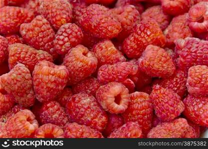 Photo of the background fresh red raspberry