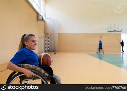 photo of the basketball team of war invalids with professional sports equipment for people with disabilities on the basketball court. High quality photo. photo of the basketball team of war invalids with professional sports equipment for people with disabilities on the basketball court