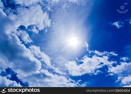 Photo of the Sun and fluffy blue sky