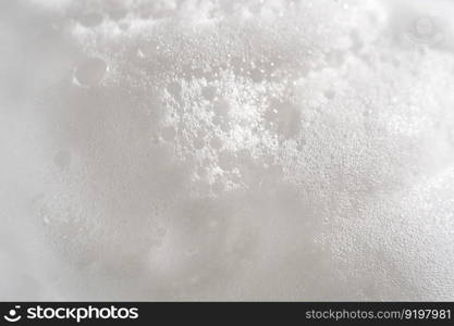 Photo of the texture of cosmetic foam or soap on a white background.. Photo of the texture of cosmetic foam or soap.