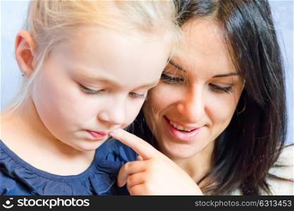 Photo of thinking mother and daughter