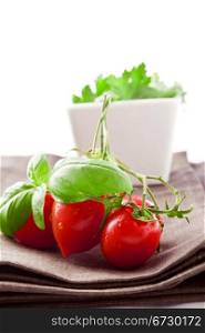 photo of tomatoes and parsley on brown napkin