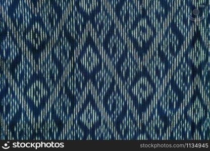 Photo of traditional thailand sarong Geometric ethnic pattern for carpet,wallpaper,clothing,wrapping,Batik,fabric,sarong, design and creative concept