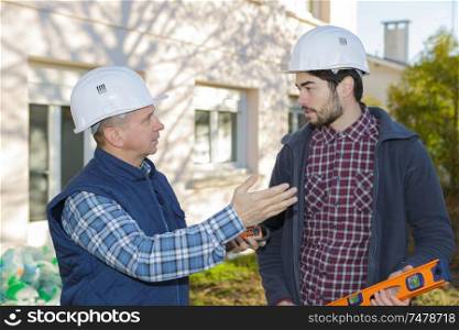 photo of two builders at construction site