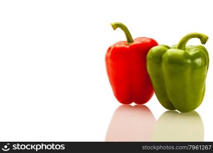 Photo of two colorful peppers over white isolated background
