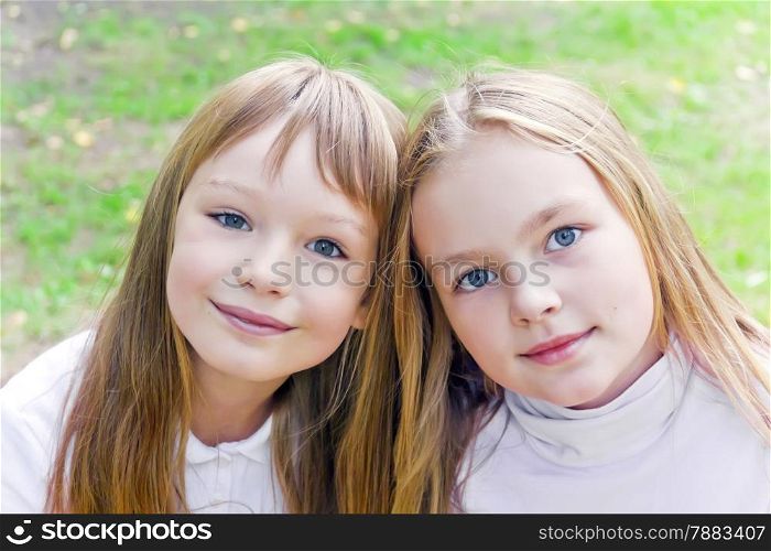 Photo of two cute girls with long hairs