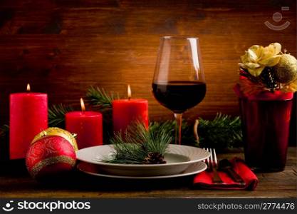 photo of wooden table with christmas ornaments illuminated by spot