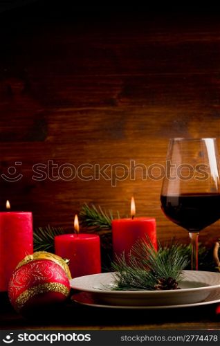 photo of wooden table with christmas ornaments illuminated by spot