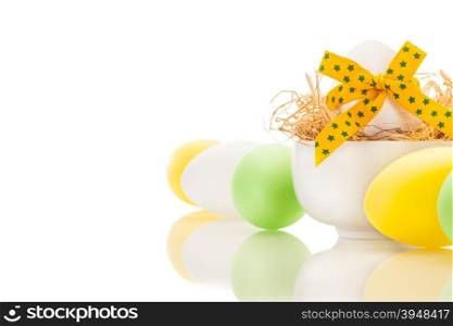 Photo of yellow easter eggs over white isolated background