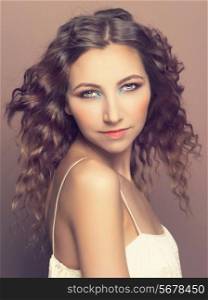 Photo of young beautiful lady with long curly hair