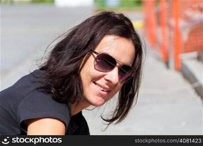 Photo of young beautiful woman in sunglasses