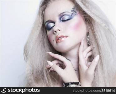 Photo of young beautiful woman with bright make-up