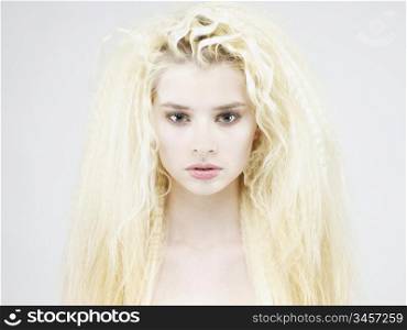 Photo of young beautiful woman with magnificent blond hair