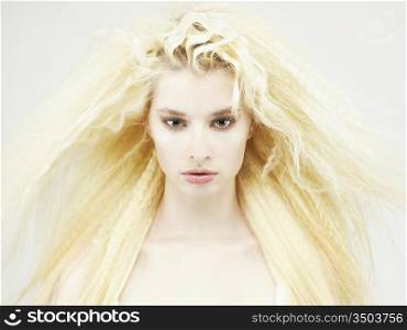 Photo of young beautiful woman with magnificent blond hair