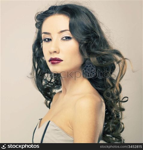 Photo of young beautiful woman with red lipstick