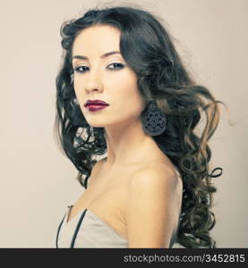 Photo of young beautiful woman with red lipstick