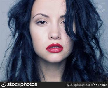Photo of young beautiful woman with red lipstick