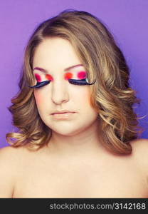 Photo of young lady with bright makeup on bright background