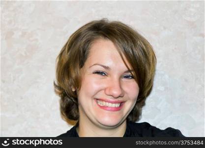 Photo of young smiling woman with brown hair