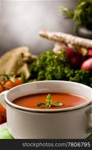 photo ofo delicious tomato soup with vegetables on wooden table