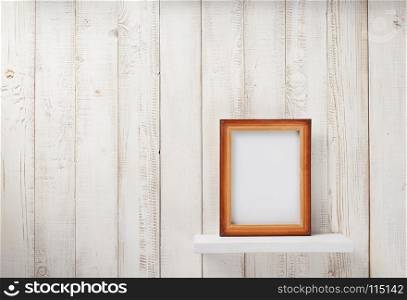 photo picture frame at white wooden shelf