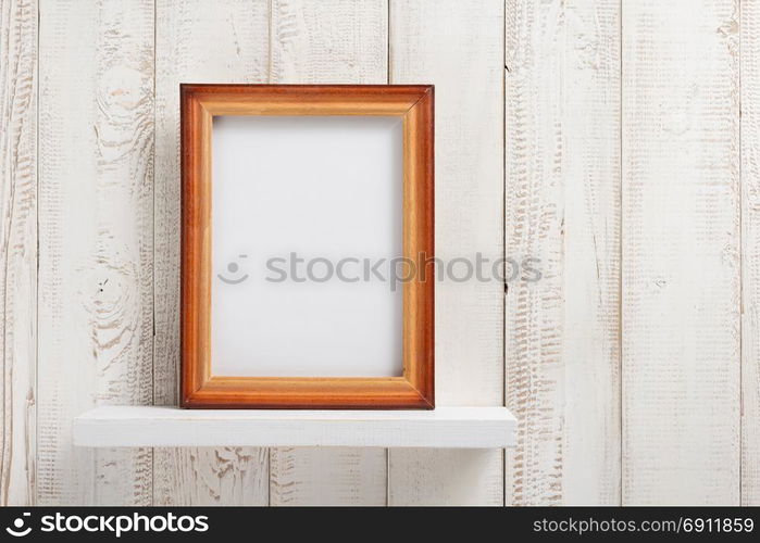 photo picture frame at white wooden shelf