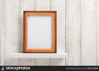 photo picture frame at white wooden shelf