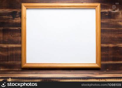 photo picture frame on wooden background with shelf at wall