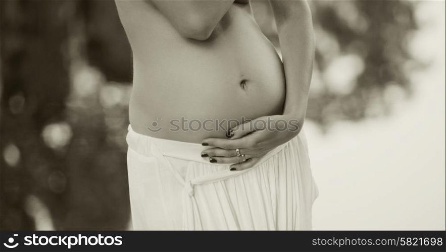 Photo presenting the belly of young pregnant woman