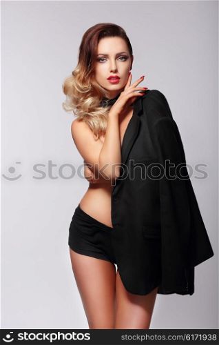 Photo shoot in the studio. Sexy Woman Wearing a Jacket.