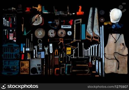 Photo top view a huge set collection of working hand and power tools many for the wooden on isolated black background, Old toolset with interior, do-it-yourself DIY tool, kit flat style, Stock hardware