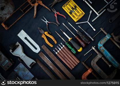 Photo top view a huge set collection of working hand and power tools many for the wooden on isolated black background, Toolset with interior, do-it-yourself DIY tool, kit flat style, Stock hardware