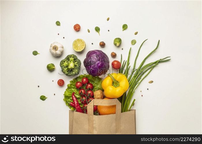 Photo Top view of assortment of vegetables in paper bag. Resolution and high quality beautiful photo. Photo Top view of assortment of vegetables in paper bag. High quality beautiful photo concept