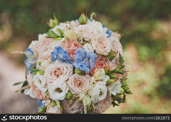 Photo wedding bouquet.. Beautiful colorful bouquet on a green background 1975.