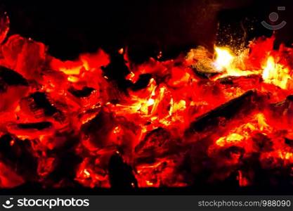 Photo with burninging coal on black background