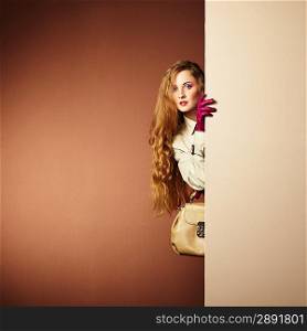 Photo young beautiful woman in a raincoat in interior. Conceptual fashion