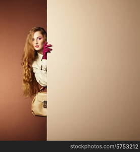 Photo young beautiful woman in a raincoat in interior. Conceptual fashion. Text background